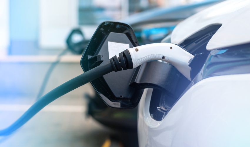 Dedicated electric vehicle charging stations in the basement of a modern luxury residential complex